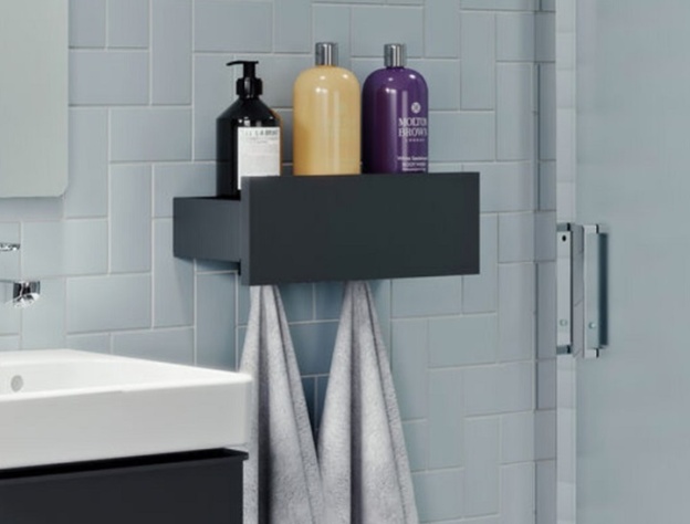 image of an open box bathroom shelf with bottles included and hanging towels underneath